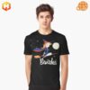 Man wearing black t-shirt with Bewitched cartoon witch design riding broomstick under full moon and stars.