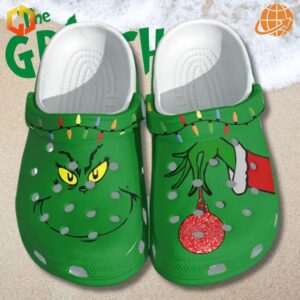 Christmas Light Grinch Crocs Shoes on snowy beach background with 