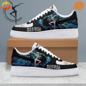 Side view of The Night Before Christmas Nike Air Force 1 Shoes with black leather upper, vibrant graphics, and Rock & Roll Hall of Fame logo.