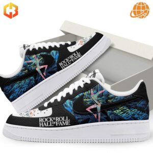 Angled side view of The Night Before Christmas Nike Air Force 1 Shoes with detailed colorful graphics, black leather upper, and Rock & Roll Hall of Fame logo.