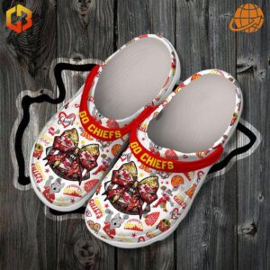 Go Chiefs Kansas City Chiefs Crocs on wooden background, showcasing detailed team graphics and red "GO CHIEFS" strap.