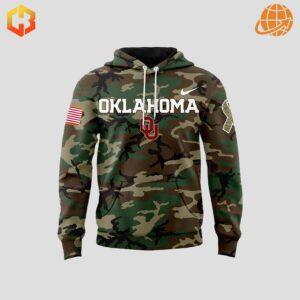 Front view of Oklahoma Sooners Military Appreciation Hoodie with camouflage design, "OKLAHOMA" text, and American flag patch.