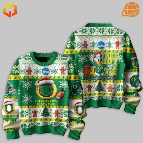 Close-up of Oregon Ducks sweater fabric showing detailed holiday-themed print