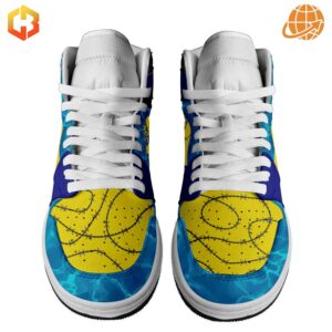 Close-up front view of Post Malone Air Jordan 1 sneakers showing yellow toe box with barbed wire pattern and blue accents.