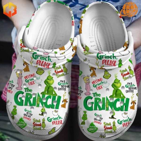 esting Grinch Face Crocs Shoes with white base and colorful Grinch-themed designs, featuring playful phrases like 'Grinch Please