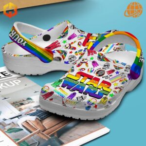 Star Wars Crocs decorated with Pride-themed Jibbitz charms.