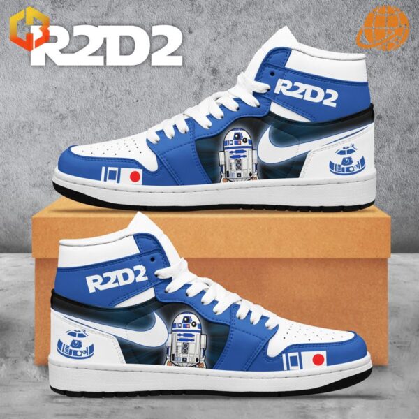 Side profile of Star Wars R2D2 Air Jordan Shoes with detailed R2D2 graphics and white laces, set against a cardboard box.