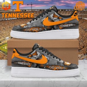 Tennessee Volunteers Nike Air Force Shoes featuring a vibrant orange swoosh and "Go Vols" graphics, set against a stadium backdrop.