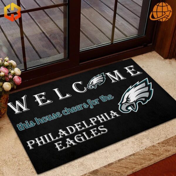 Welcome This House Cheers for the Philadelphia Eagles Doormat next to a basketball, highlighting its versatility.